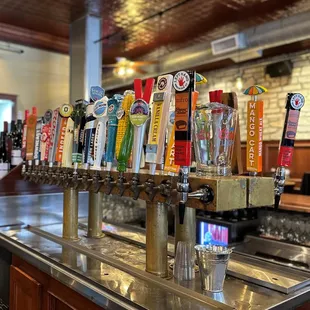 a row of beer taps