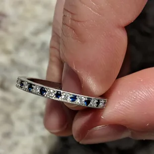 matching wedding band. platinum band with alternating pave diamonds and sapphires. perfect!