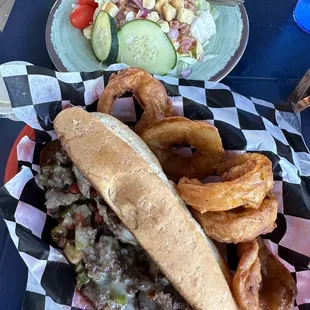 Philly with onion rings and side salad.