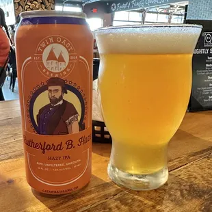 a can and a glass of beer