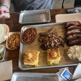 Ribs, pulled pork, jalapeño cornbread, baked beans, coleslaw, bbq peanuts