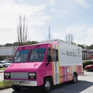 the queso truck parked in a parking lot