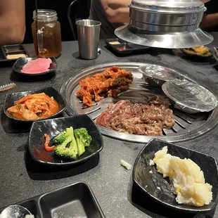 2 meat orders on the grill, limited veggie side dishes,  2 aluminum dishes on the grill are the steamed egg dish- come out cold