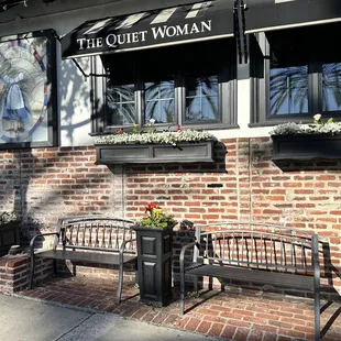 a brick building with two benches