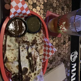 Asada quesadilla with red and green salsa. Spicy!