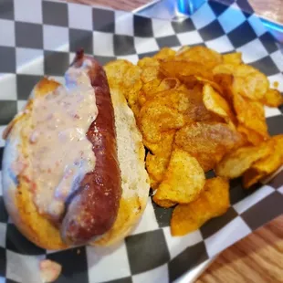 House smoked sausage smothered in house smoked queso