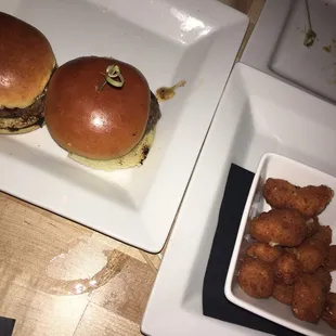 Sliders with cheese, pomegranate bbq sauce and a pickle. Cheese curds with a yogurt, chives aioli.