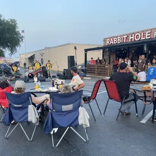 people sitting at tables outside