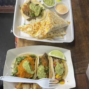 two tacos and guacamole