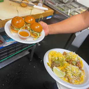 two plates of food being served