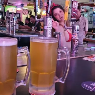 two beer glasses on the bar