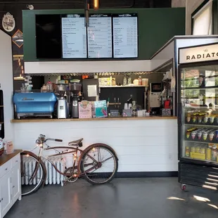 a bicycle parked in front of a bar