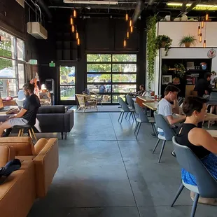 a group of people sitting at tables