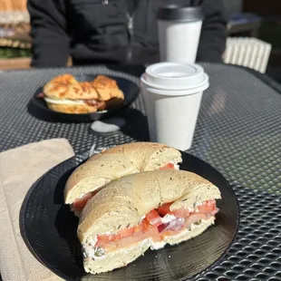 Lox, cream cheese, capers, tomato, onion on a rosemary bagel.