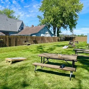 several picnic tables in the yard