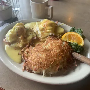 Eggs Benedict with hash browns and coffee