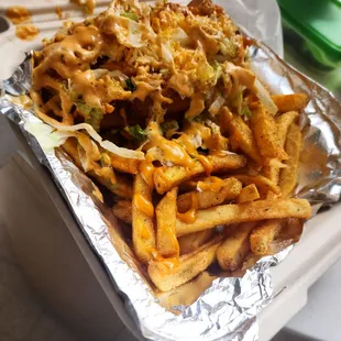 Shrimp Po-Boy and fries with spicy Cajun sauce.