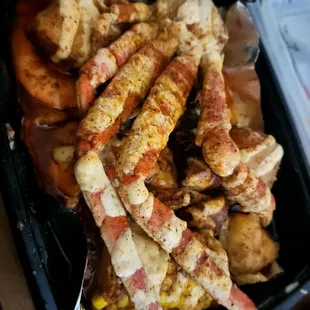 The raider claw (crab legs, potatoes, corn on the cob, sausage, and shrimp. With mild spicy sauce Cajun ranch on top)