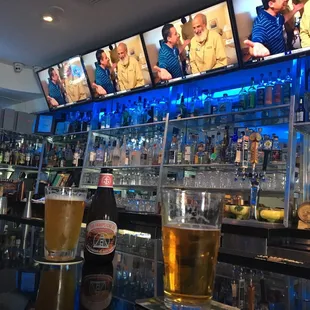 a beer and televisions