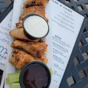 Crispy wings with BBQ and ranch on the side.