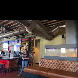 a woman standing at the bar