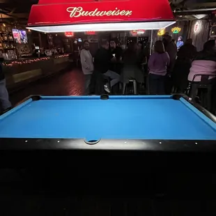 a pool table in a bar
