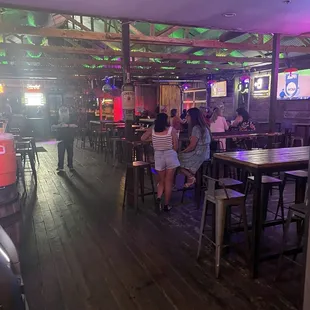 Inside with a deejay playing. Like a whole different bar inside with different vibe.