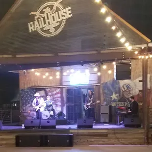 outdoor concert venue with table seating or dance floor option