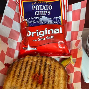 a bag of potato chips and a grilled cheese sandwich