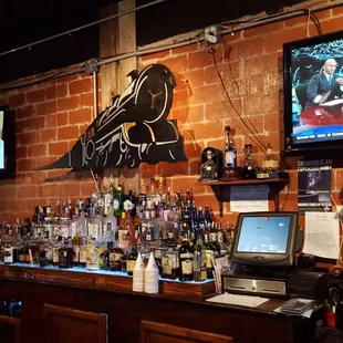 a brick bar with a laptop on it