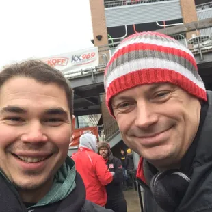 two men smiling for the camera