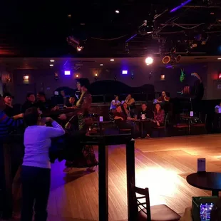 a group of people dancing in a dance studio