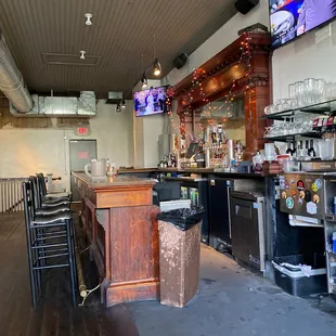 a bar with a television on the wall