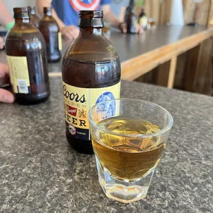 Happy hour Saturday special! Buy first round, second is free! We got shots of Old Grand Dad and Banquets.