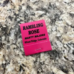 a pink label on a granite countertop