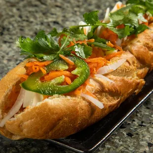 a hot dog with toppings