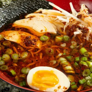 a bowl of ramen with an egg