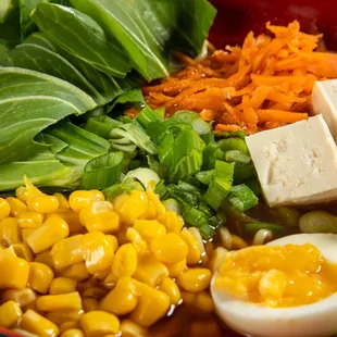 a bowl of ramen and vegetables