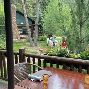 Husband enjoying a horseback riding ride thru the ranch