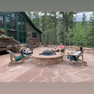 Fire pit in front of hill cabin