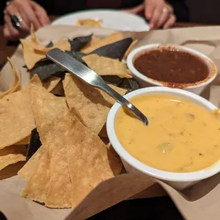 Chips, (surprisingly good) salsa and queso