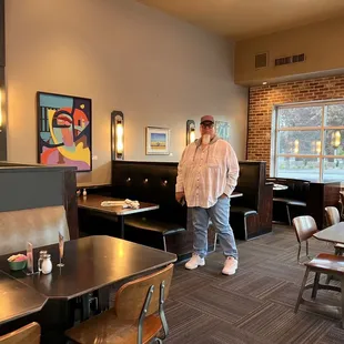 a man standing in a restaurant