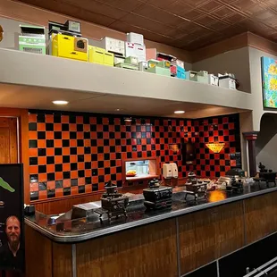 Toy and antique kitchen ranges on display.