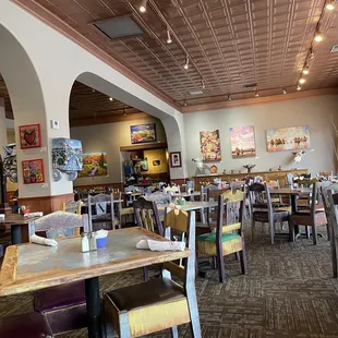 a dining room with tables and chairs