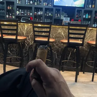 a man holding a cigar