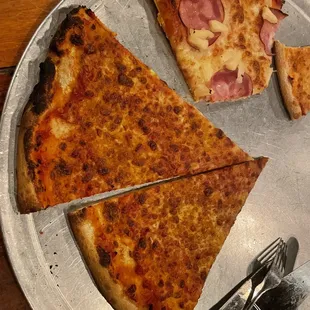 Burnt cheese pizza with a cracker crust. I did not ask for thin crust.