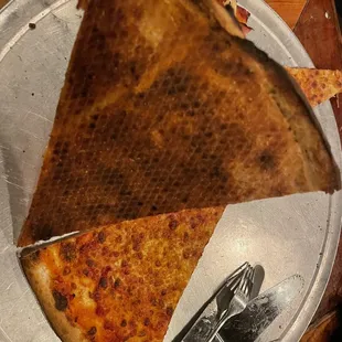 Burnt pizza.