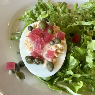 Smoked salmon deviled eggs. Topped with pickled red onion and capers!