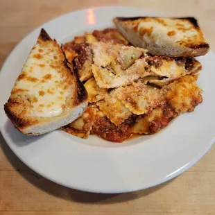 Traditional ravioli with bolognese sauce