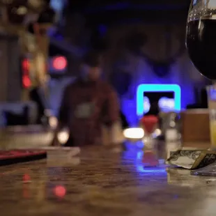 a glass of wine on the bar